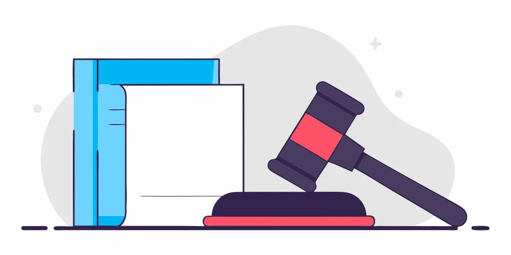 Misclassification lawsuit gavel and law books.